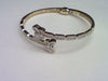 10KT 1.42-1.43 CT D- BANGLE "BUTTERFLY" BAGUETTES